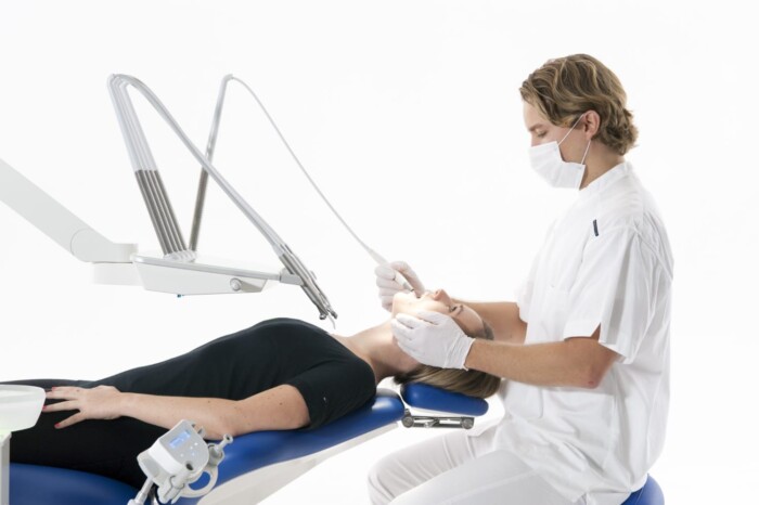 Dentist and patient on UnicLine S