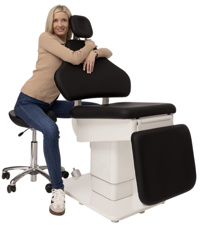 Woman and black patient chair from Heka